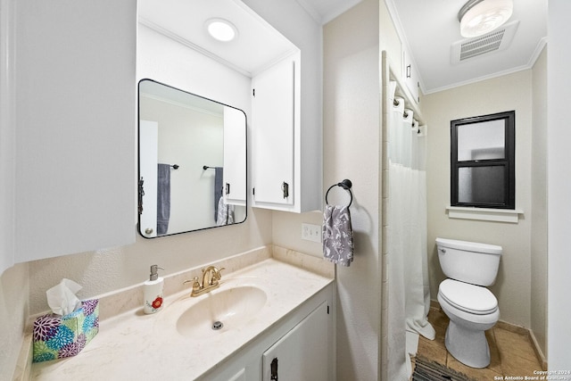 bathroom with vanity, toilet, and ornamental molding