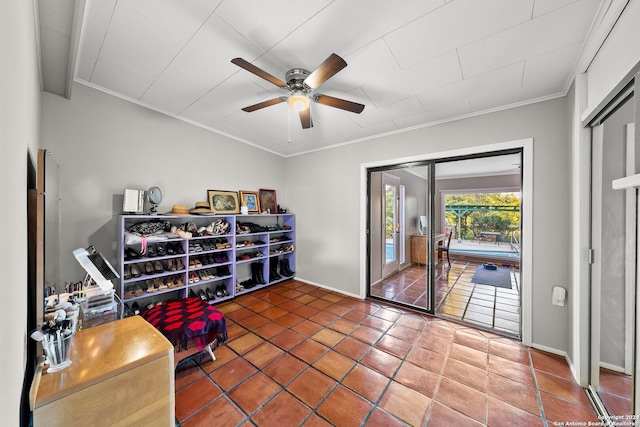 living area with tile patterned floors, ceiling fan, and crown molding