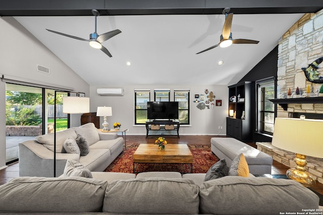 living room featuring hardwood / wood-style flooring, a healthy amount of sunlight, and beamed ceiling