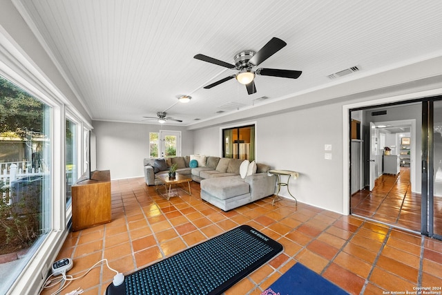 interior space with ceiling fan