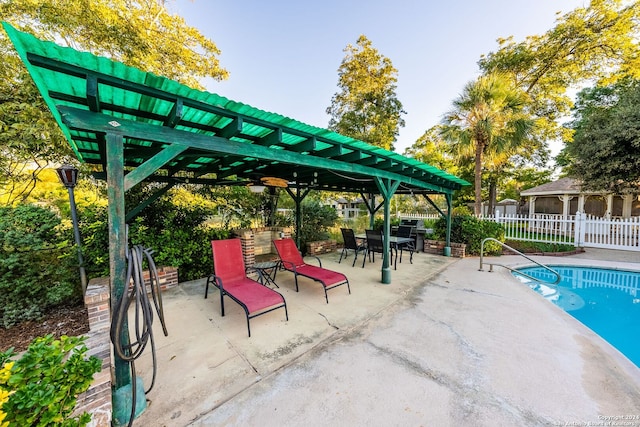 view of swimming pool with a pergola and a patio area