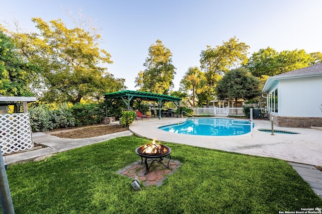 view of pool featuring a gazebo, a patio, an outdoor fire pit, and a yard