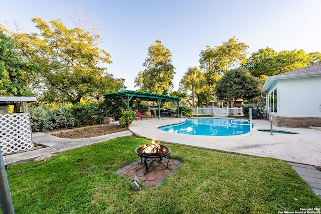 view of swimming pool with a gazebo, a patio area, a lawn, and an outdoor fire pit