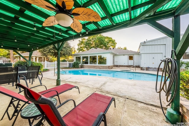 view of pool with ceiling fan and a patio