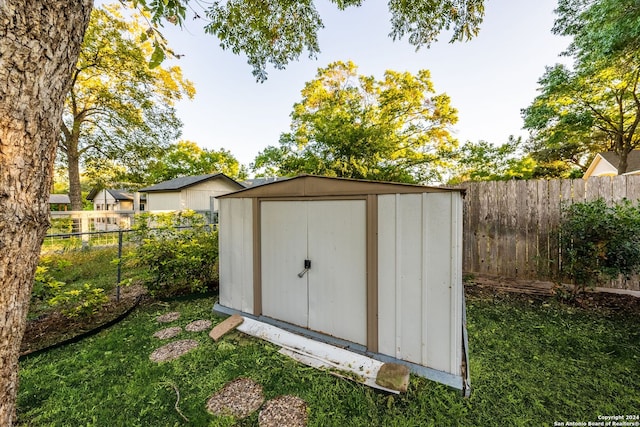 view of outbuilding featuring a yard