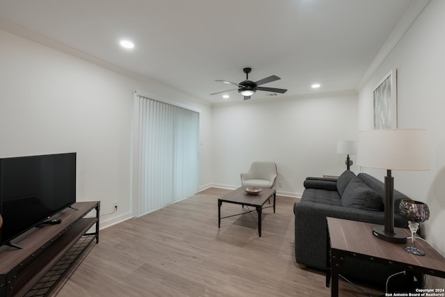 living room with ceiling fan, light hardwood / wood-style flooring, and ornamental molding