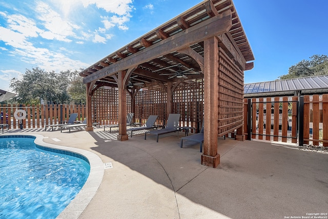 view of pool featuring a patio and ceiling fan