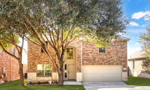 view of front facade featuring a front lawn and a garage