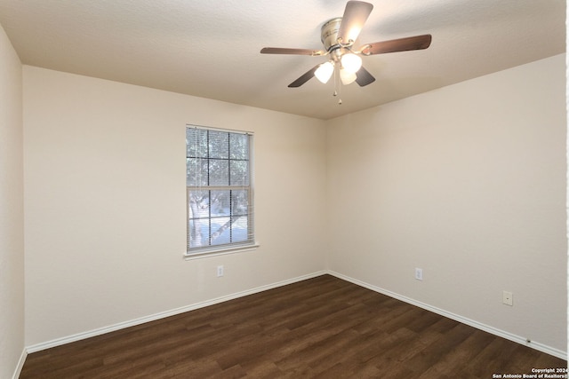 empty room featuring dark hardwood / wood-style floors and ceiling fan