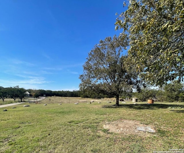 view of yard with a rural view