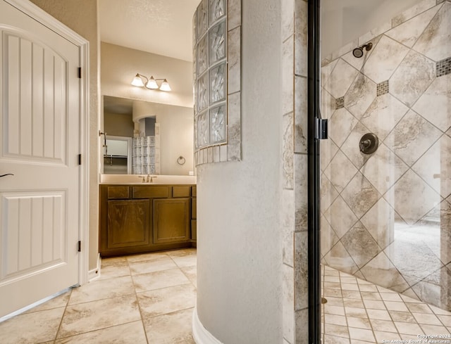 bathroom with vanity and an enclosed shower