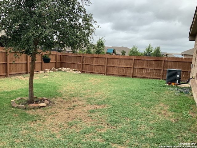 view of yard featuring central AC