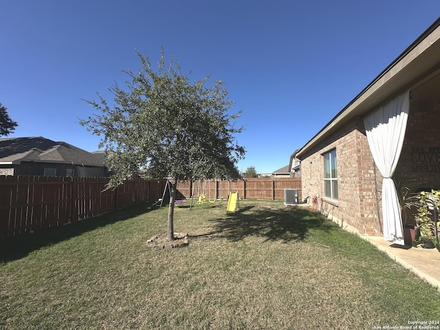 view of yard featuring central AC unit