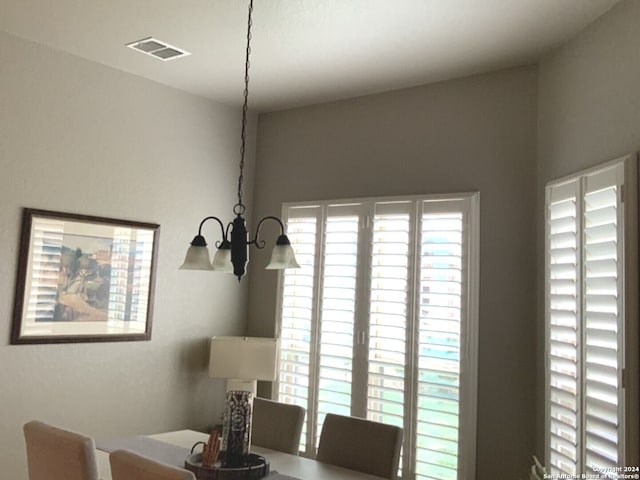 dining space featuring a chandelier