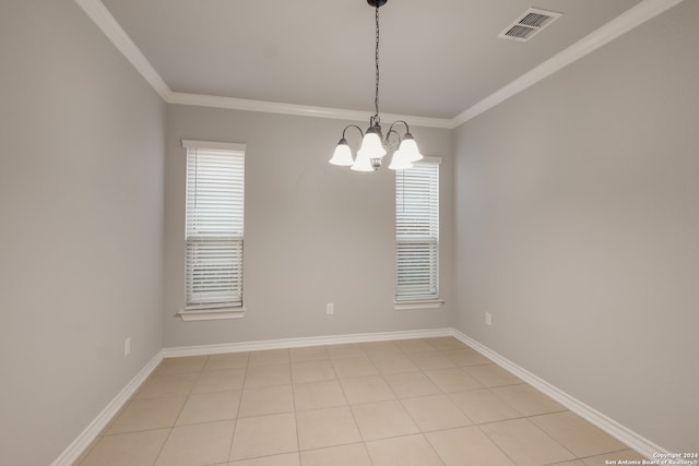 tiled spare room with crown molding and a notable chandelier