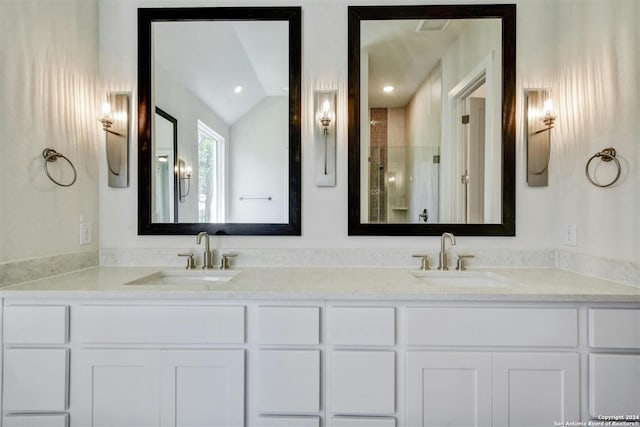 bathroom featuring vanity and vaulted ceiling