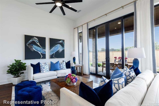 living room with ceiling fan, french doors, and dark hardwood / wood-style floors