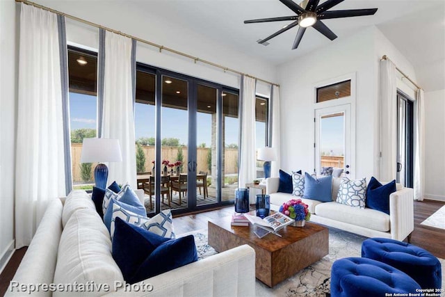 living room with ceiling fan and wood-type flooring