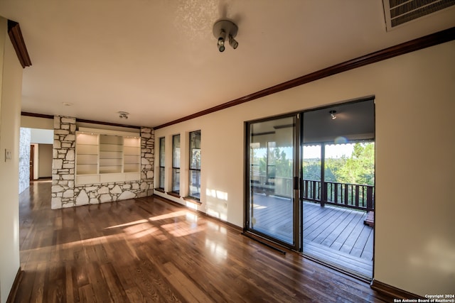 unfurnished room with crown molding and dark hardwood / wood-style floors