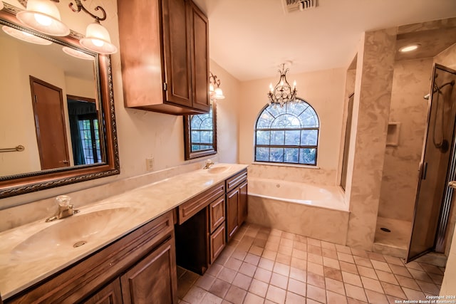 bathroom with shower with separate bathtub, vanity, tile patterned floors, and a notable chandelier