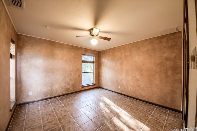 spare room with ceiling fan