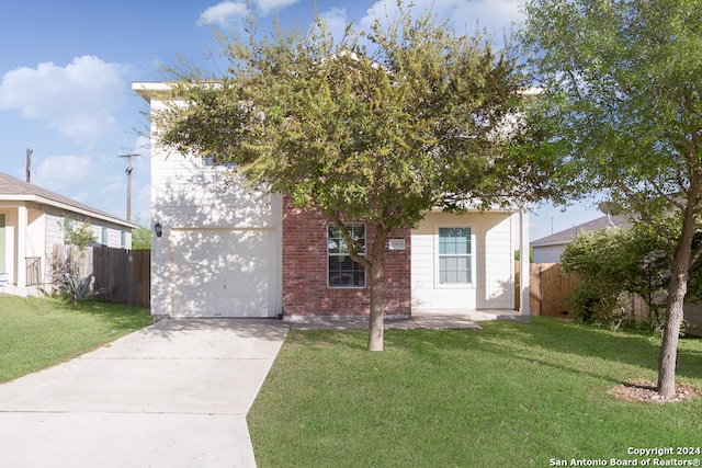 view of front of home with a garage and a front lawn