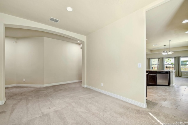 empty room featuring light colored carpet