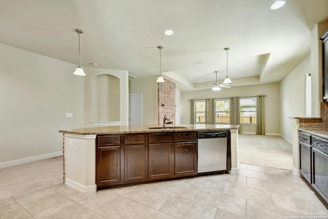 kitchen featuring stainless steel dishwasher, pendant lighting, sink, and light carpet