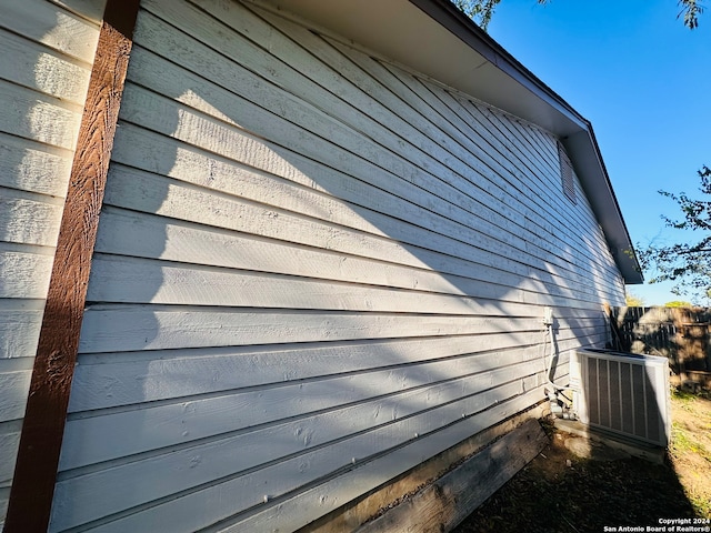 view of side of property featuring central AC