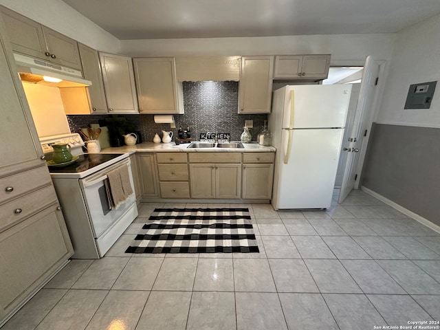 kitchen with tasteful backsplash, white appliances, sink, light tile patterned floors, and light brown cabinets