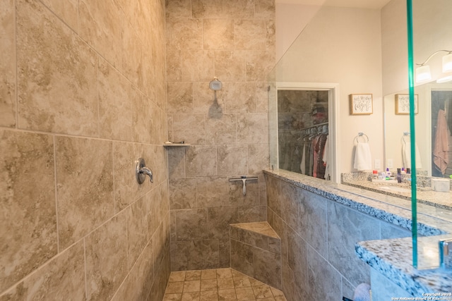 bathroom featuring a tile shower