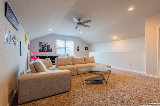 living room featuring carpet, vaulted ceiling, and ceiling fan