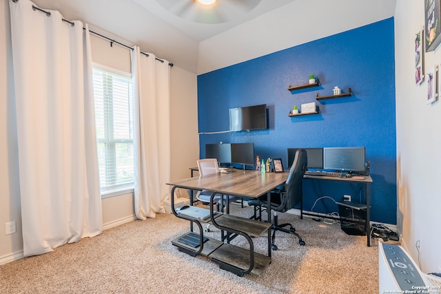 carpeted office featuring ceiling fan