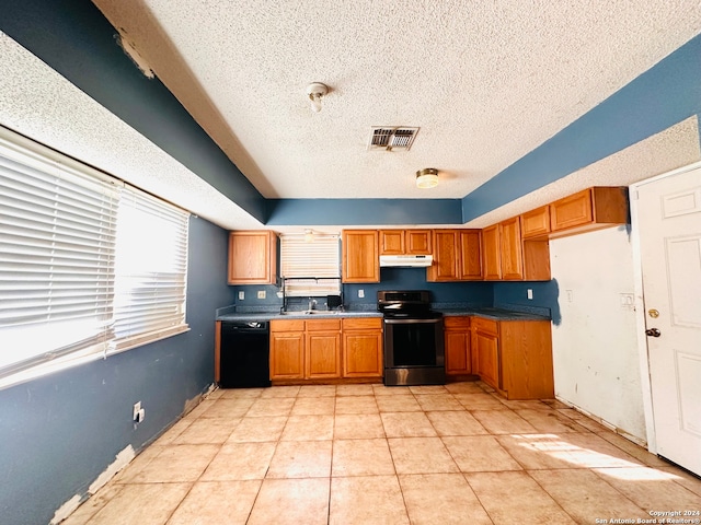 kitchen featuring a textured ceiling, dishwasher, light tile patterned floors, and stainless steel electric range