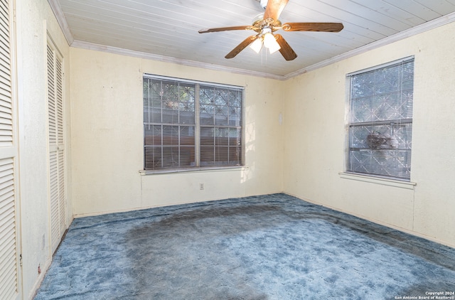 unfurnished bedroom featuring carpet flooring, ceiling fan, and crown molding