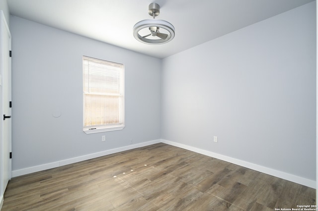 spare room with hardwood / wood-style flooring