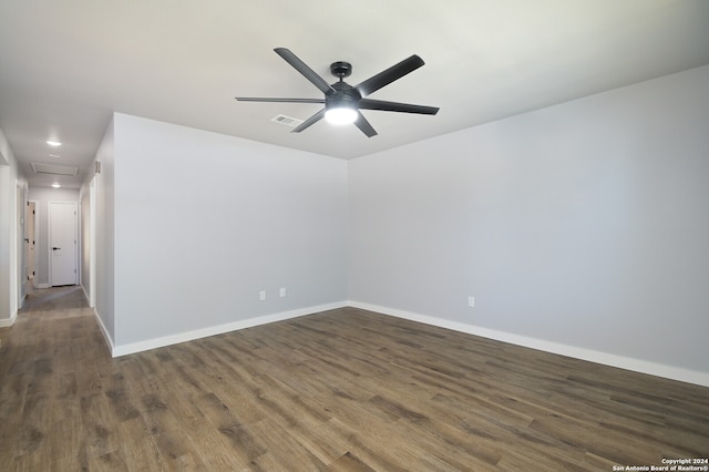 unfurnished room with dark hardwood / wood-style floors and ceiling fan