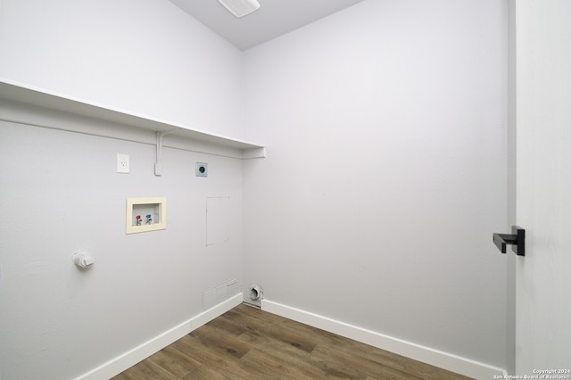 clothes washing area with hookup for an electric dryer, hookup for a washing machine, dark hardwood / wood-style flooring, and gas dryer hookup