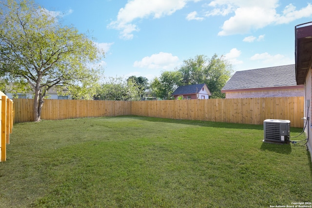 view of yard with central AC unit