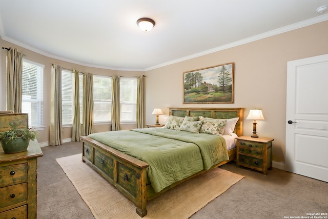 bedroom featuring multiple windows, light carpet, and crown molding