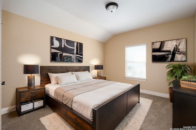 carpeted bedroom with vaulted ceiling