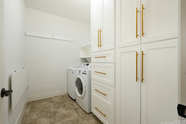 laundry area featuring cabinets and independent washer and dryer