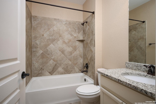 full bathroom with vanity, toilet, and tiled shower / bath combo