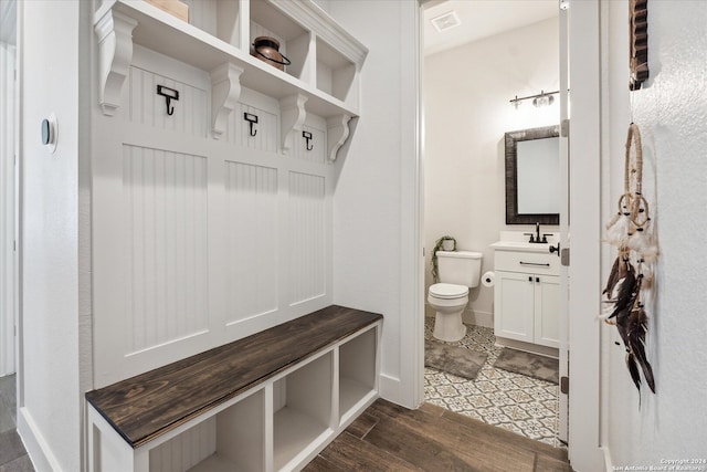 mudroom featuring dark wood-type flooring