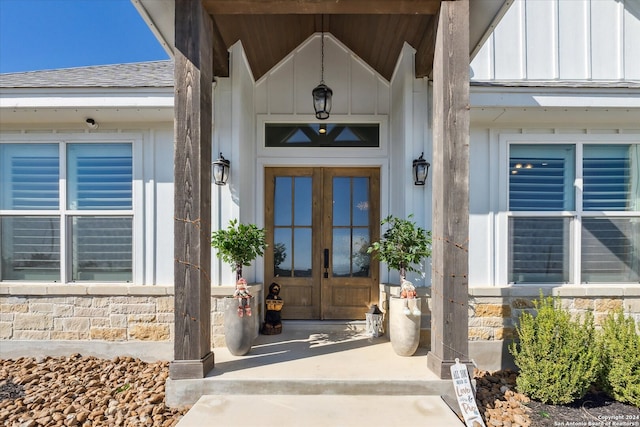 view of exterior entry featuring french doors