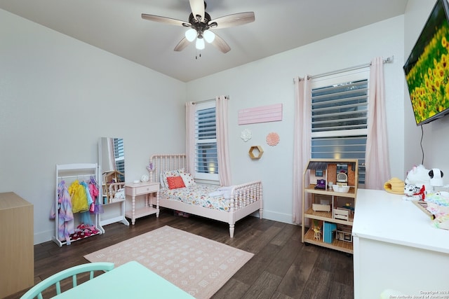 bedroom with ceiling fan and dark hardwood / wood-style floors