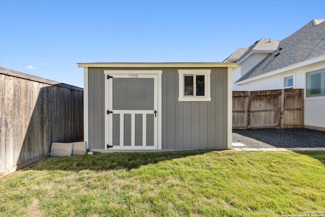 view of outdoor structure with a yard