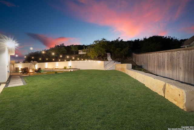 yard at dusk with a water view