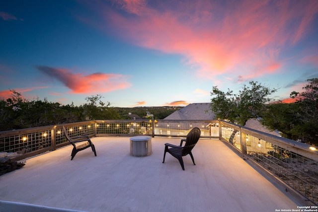 view of patio terrace at dusk