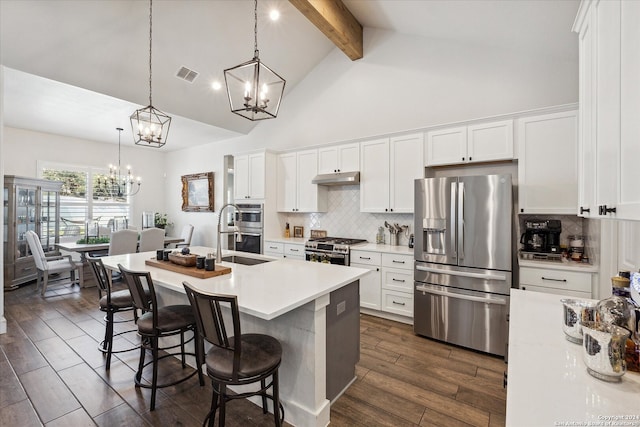 kitchen featuring stainless steel appliances, dark hardwood / wood-style flooring, beamed ceiling, decorative light fixtures, and white cabinets